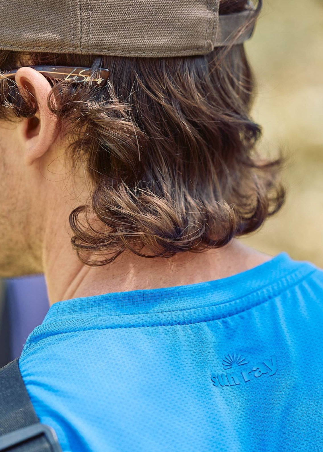 Sun smart man in Sun Ray UPF50+ Sun Protection Clothing All G Long Sleeve Tee True Blue and Shade Cap Australia