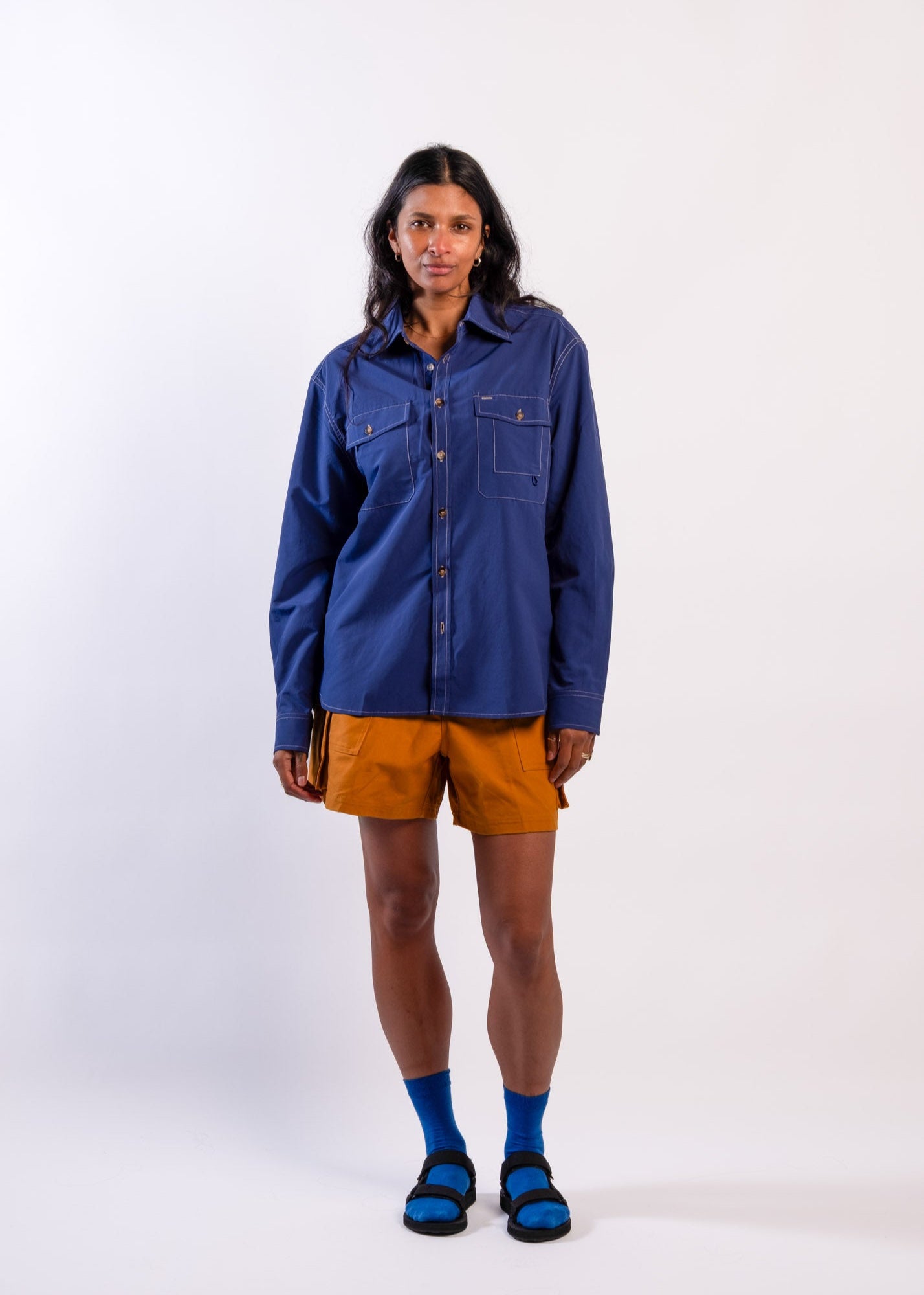 Person wearing a blue Sun Ray UPF50+ sun protection overshirt