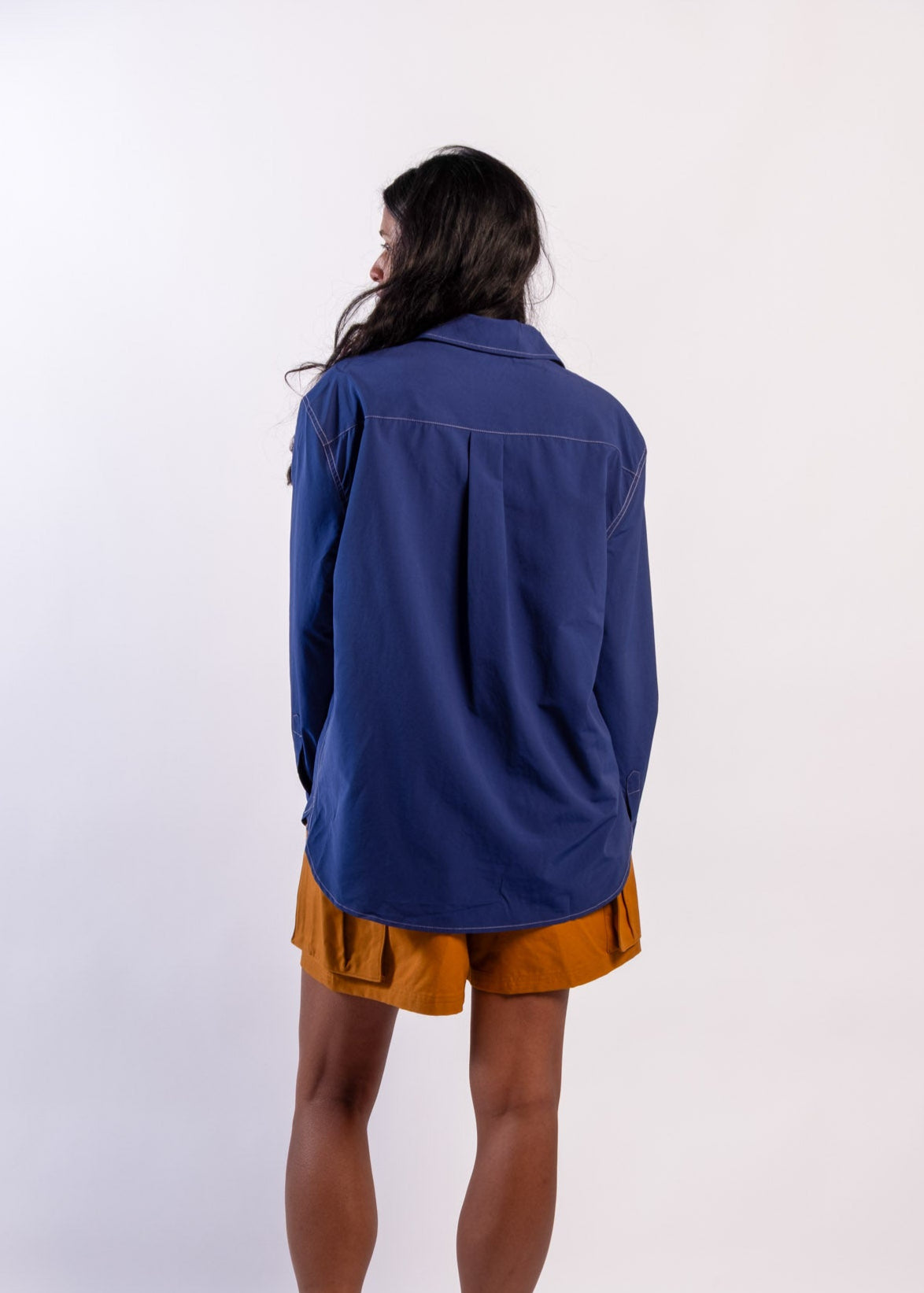 Person wearing a blue Sun Ray UPF50+ sun protection overshirt