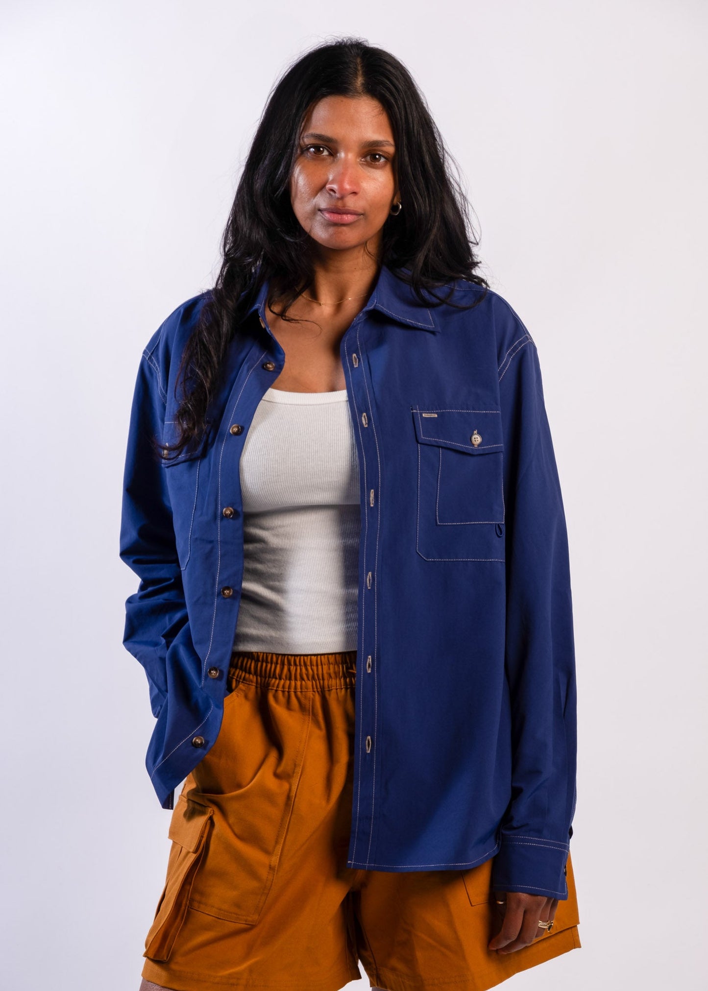 Person wearing a blue Sun Ray UPF50+ sun protection overshirt