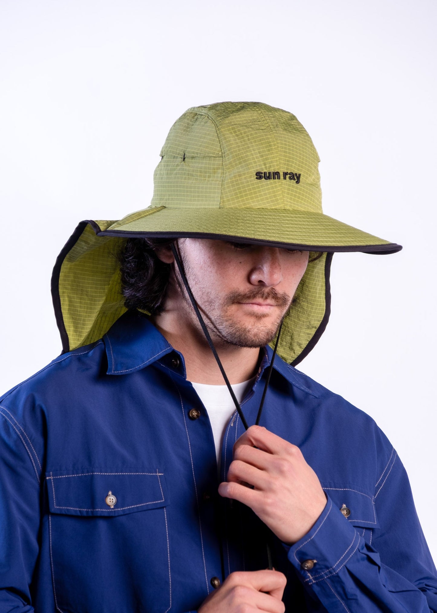 Person wearing a sun ray green sun protection UPF50+ seriously shady hat with neck cover