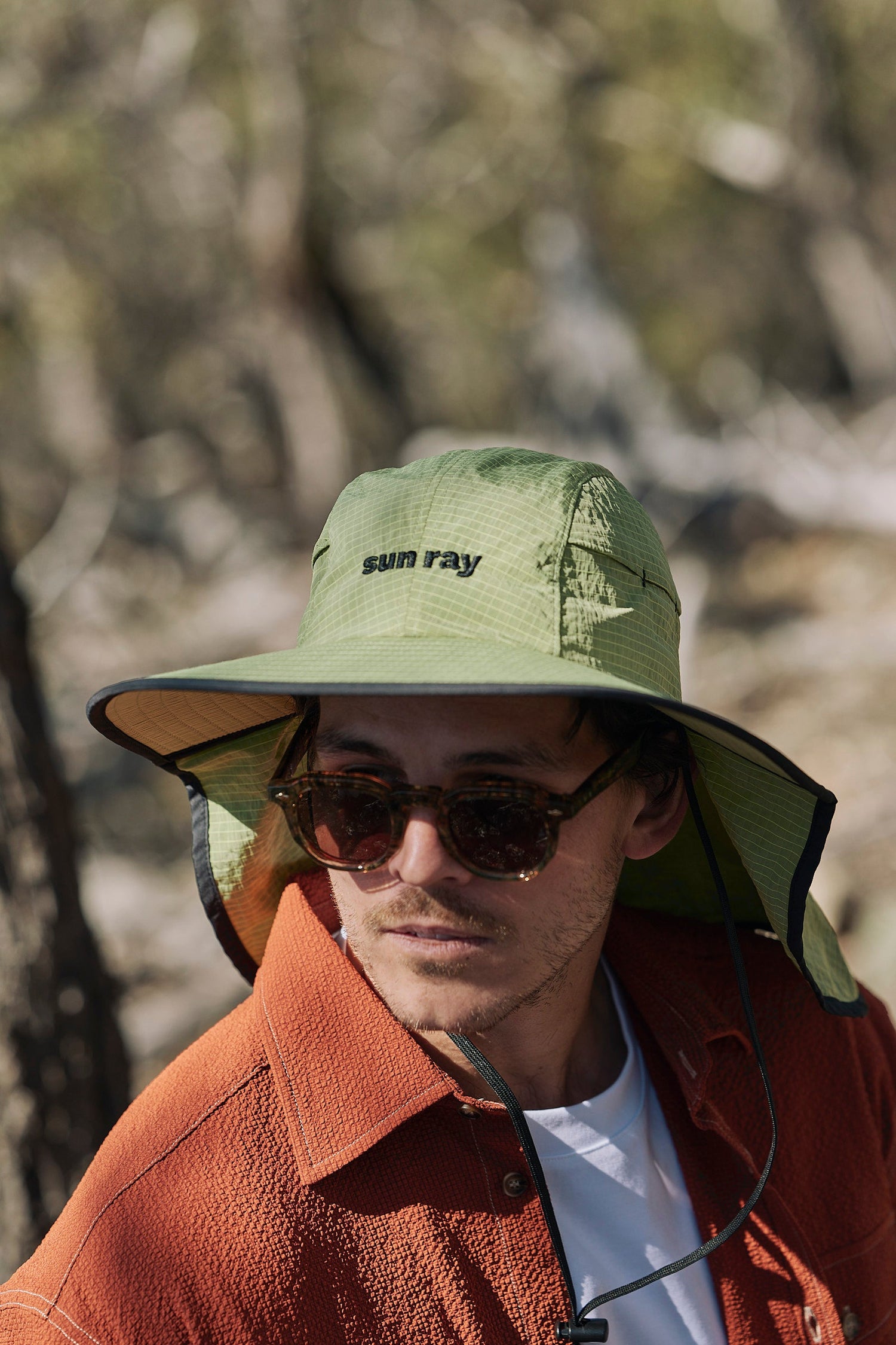 Model wearing Mullet Brimmer Hat with UPF50+ neck protection in Australia