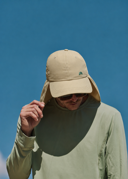 A man wearing a stone legionnaire sun hat with a neck flap and a light sage green long-sleeve shirt UPF50+ Sun Ray