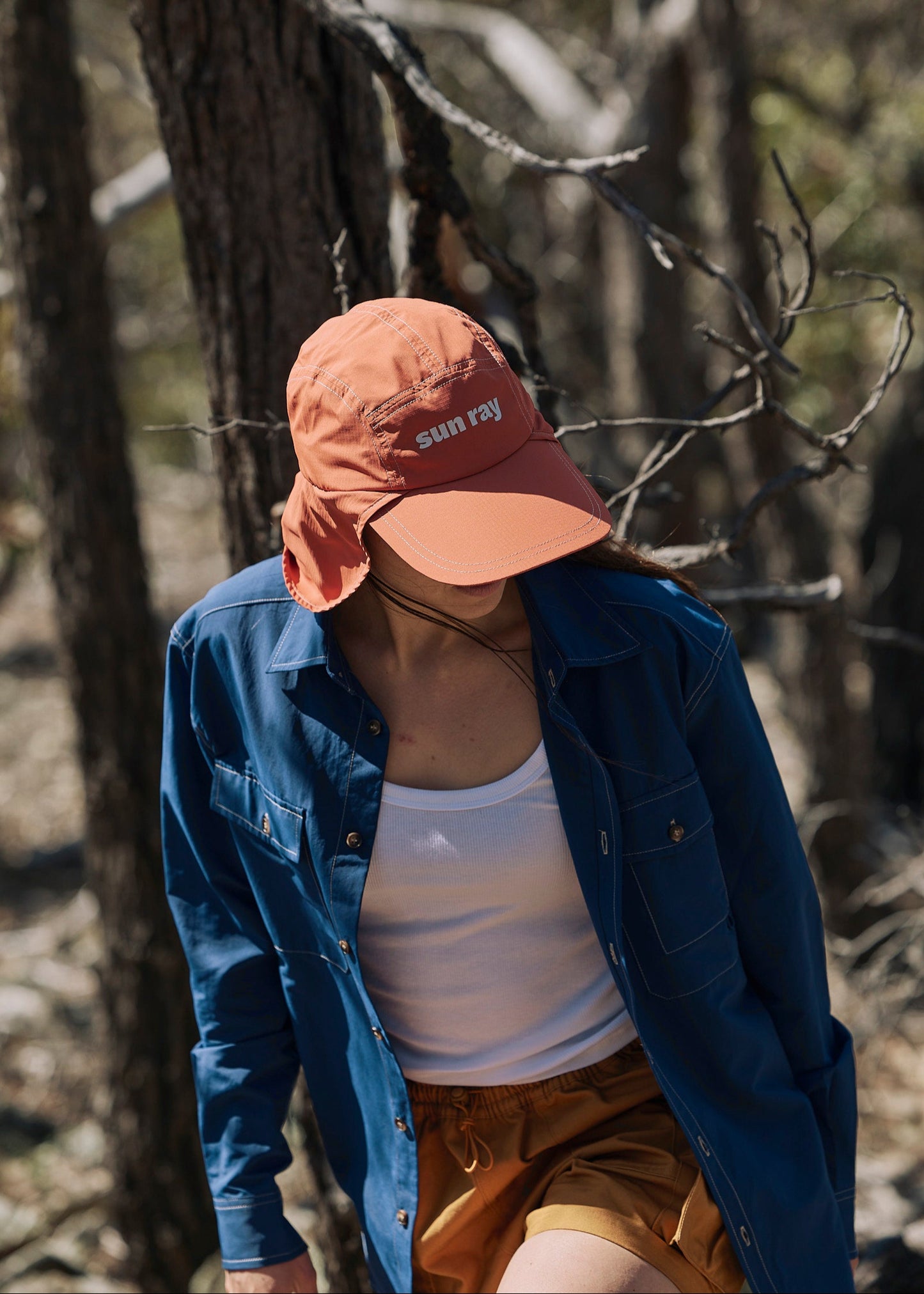 Person wearing a blue Sun Ray UPF50+ sun protection overshirt sun shirt