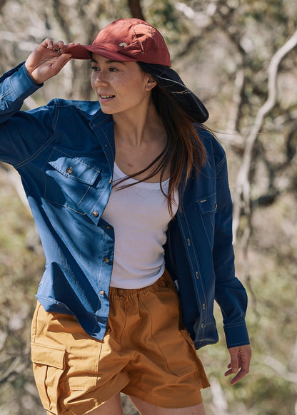 Person wearing a blue Sun Ray UPF50+ sun protection overshirt sun shirt