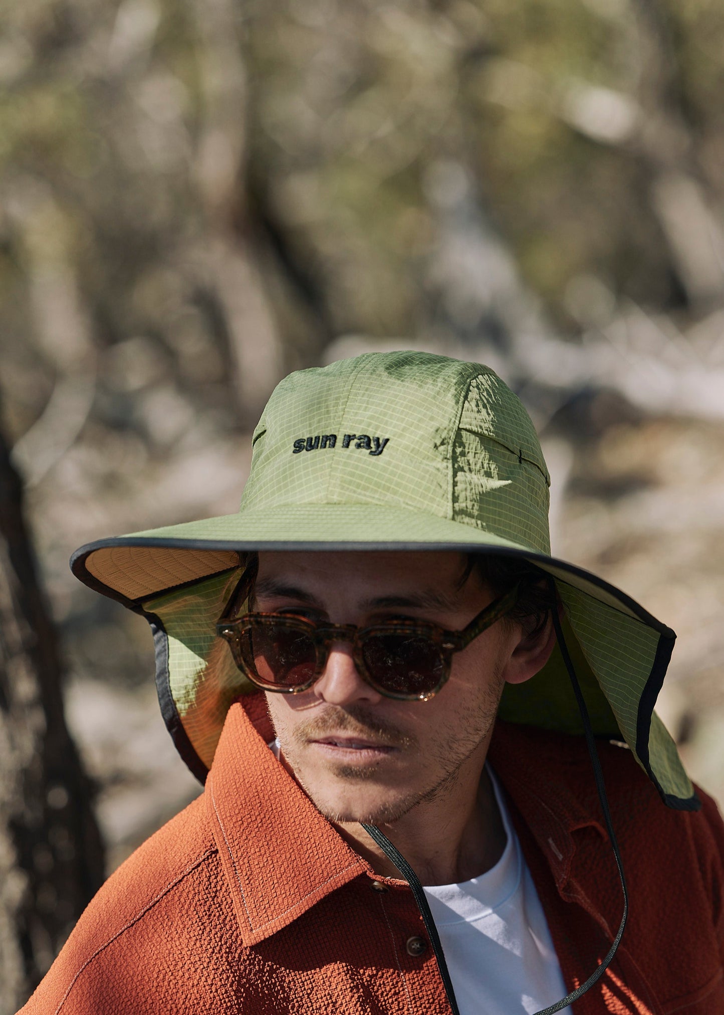 Person wearing a sun ray green sun protection UPF50+ seriously shady hat with neck cover