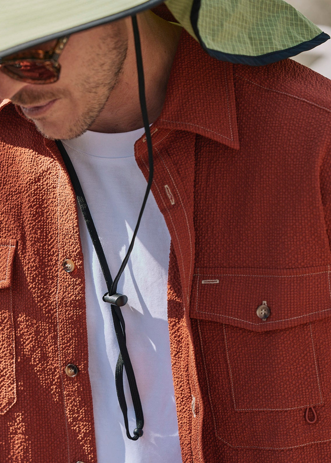 Person wearing Sun Ray UPF50+ sun protection seersucker overshirt sun shirt