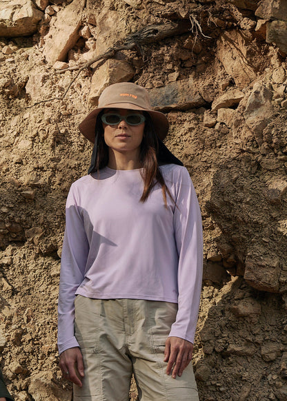 A sun smart woman wears the Sun Ray UPF50+ Sun Protection Clothing All G Long Sleeve Tee lilac boxy fit