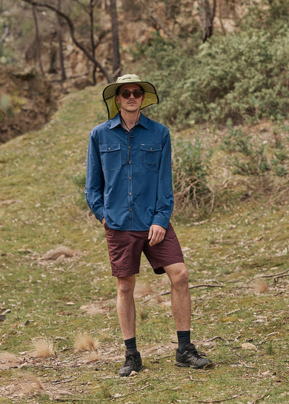 Person wearing a blue Sun Ray UPF50+ sun protection overshirt sun shirt