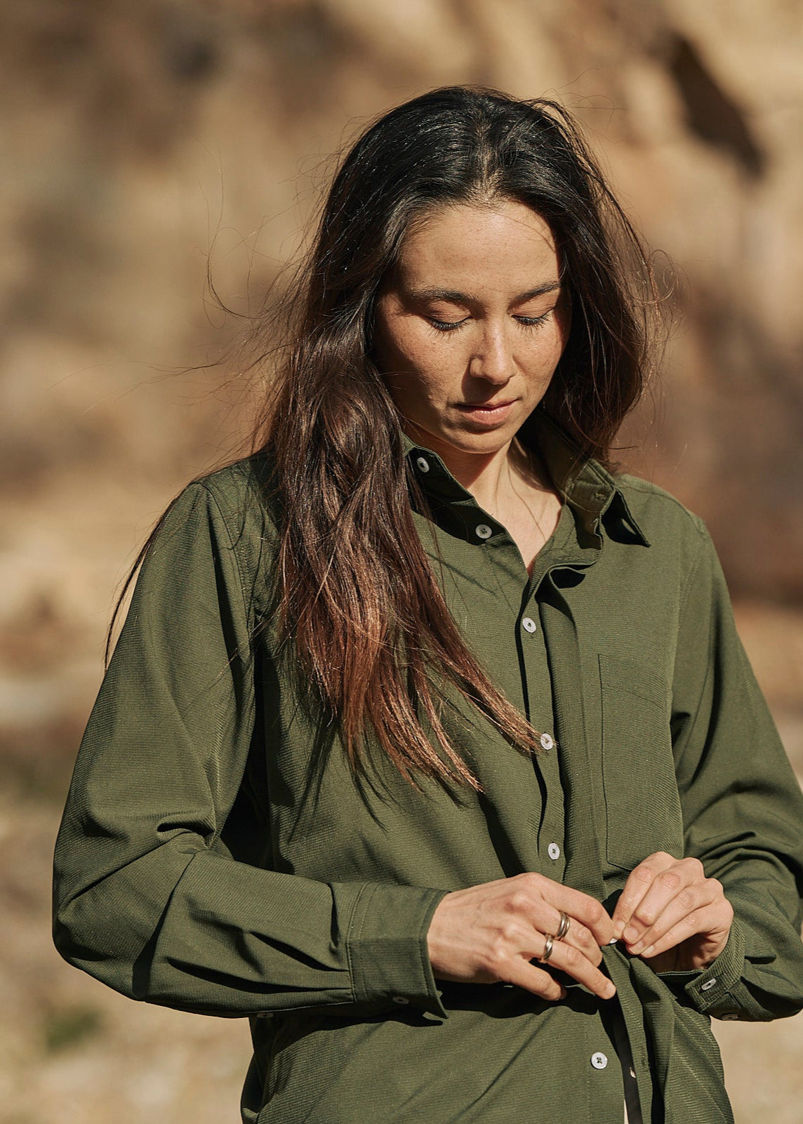 Person wearing olive green Sun Ray UPF50+ sun protection sun shirt