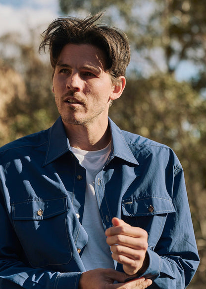 Person wearing a blue Sun Ray UPF50+ sun protection overshirt sun shirt