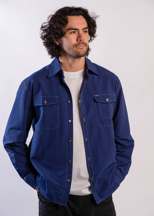 Person wearing a blue Sun Ray UPF50+ sun protection overshirt