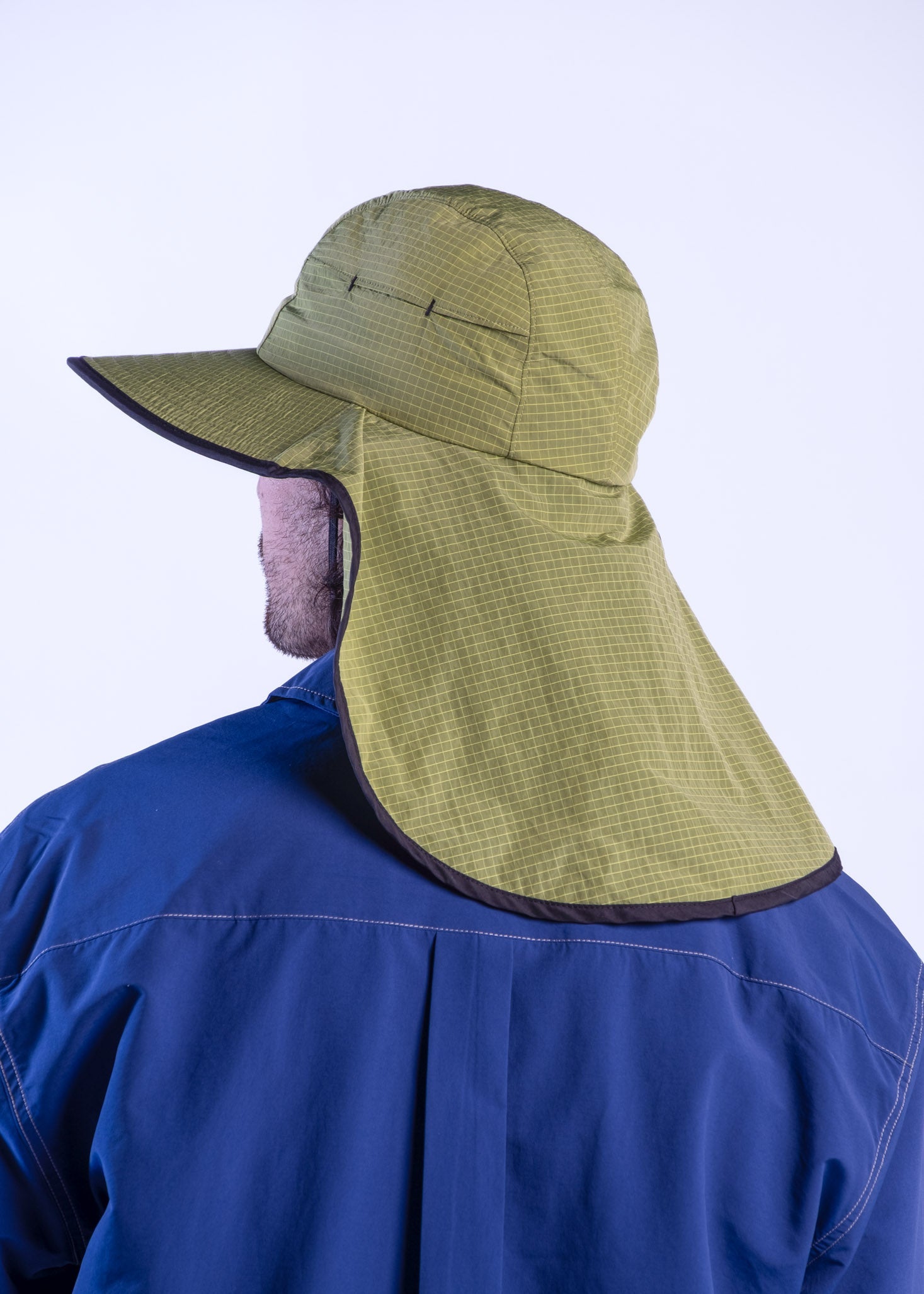 Person wearing a sun ray green sun protection UPF50+ seriously shady hat with neck cover