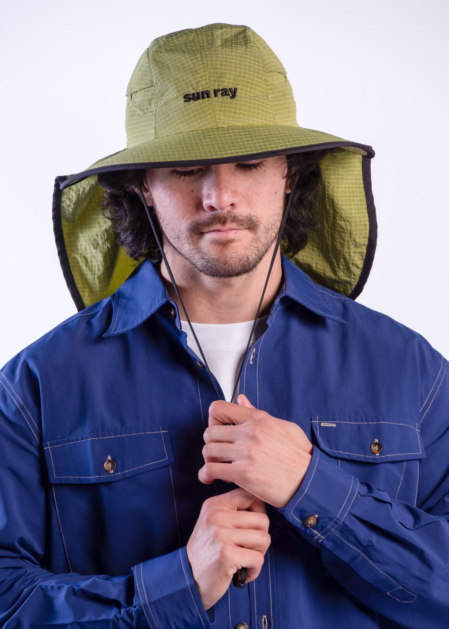 Person wearing a sun ray green sun protection UPF50+ seriously shady hat with neck cover