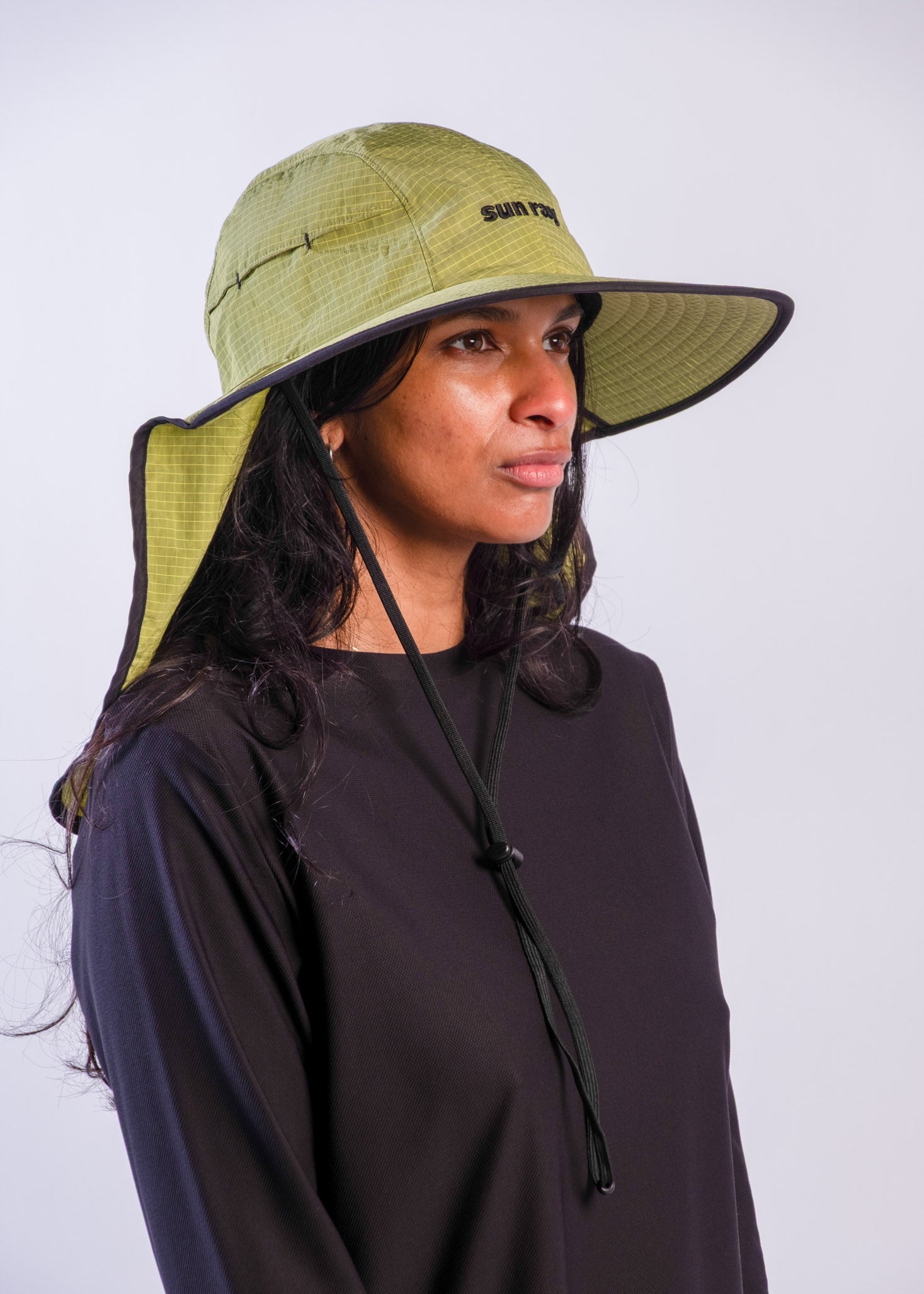 Person wearing a sun ray green sun protection UPF50+ seriously shady hat with neck cover