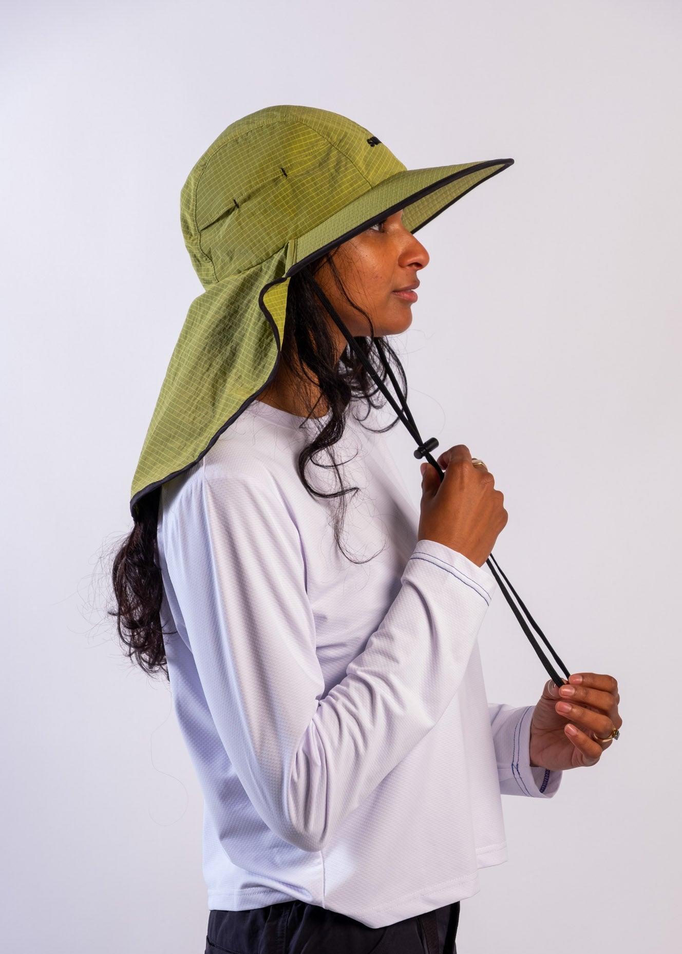 Person wearing a sun ray green sun protection UPF50+ seriously shady hat with neck cover