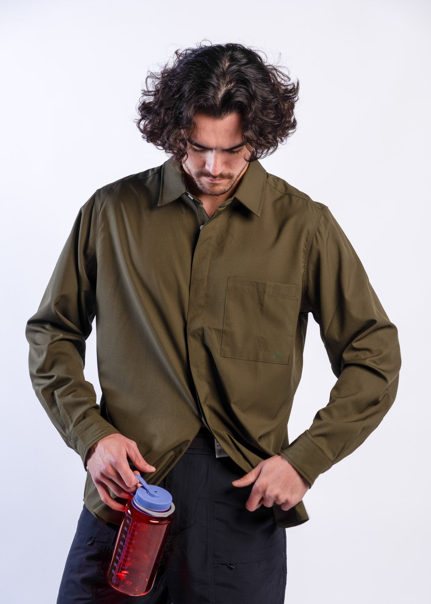 Person wearing olive green Sun Ray UPF50+ sun protection sun shirt