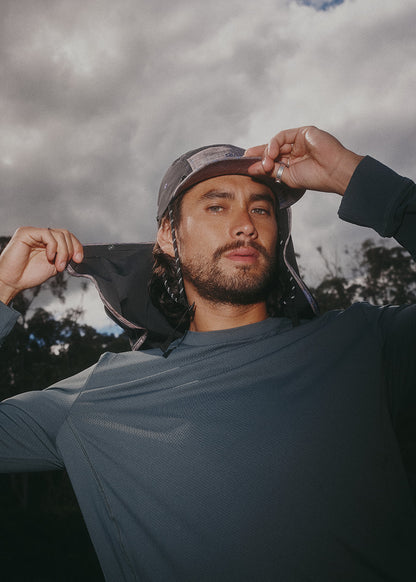 Runner wearing Sun Ray UPF50+ Stay-Put Flap Cap with neck flap on a trail