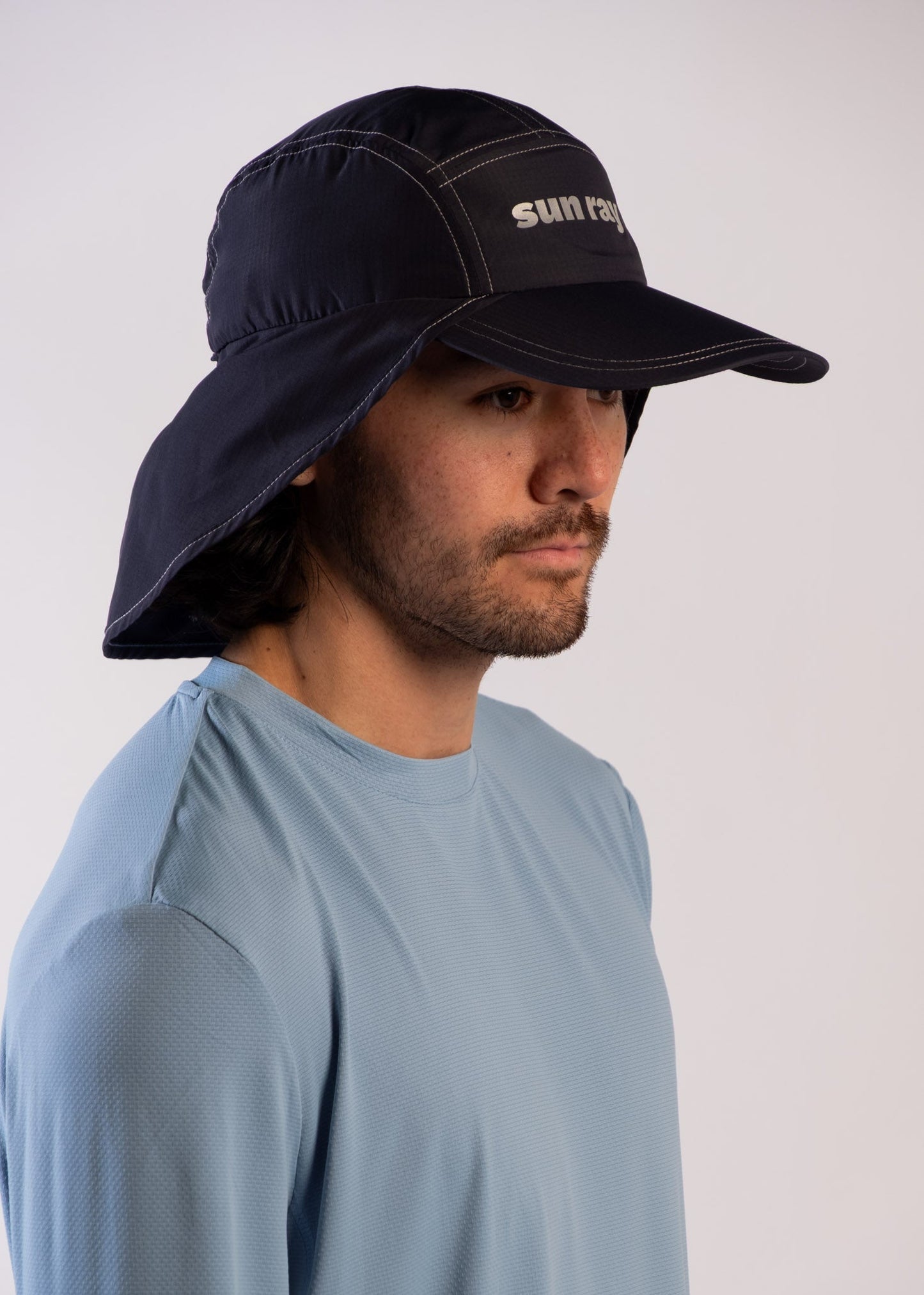 Person wearing a UPF50+ navy legionnaire hat