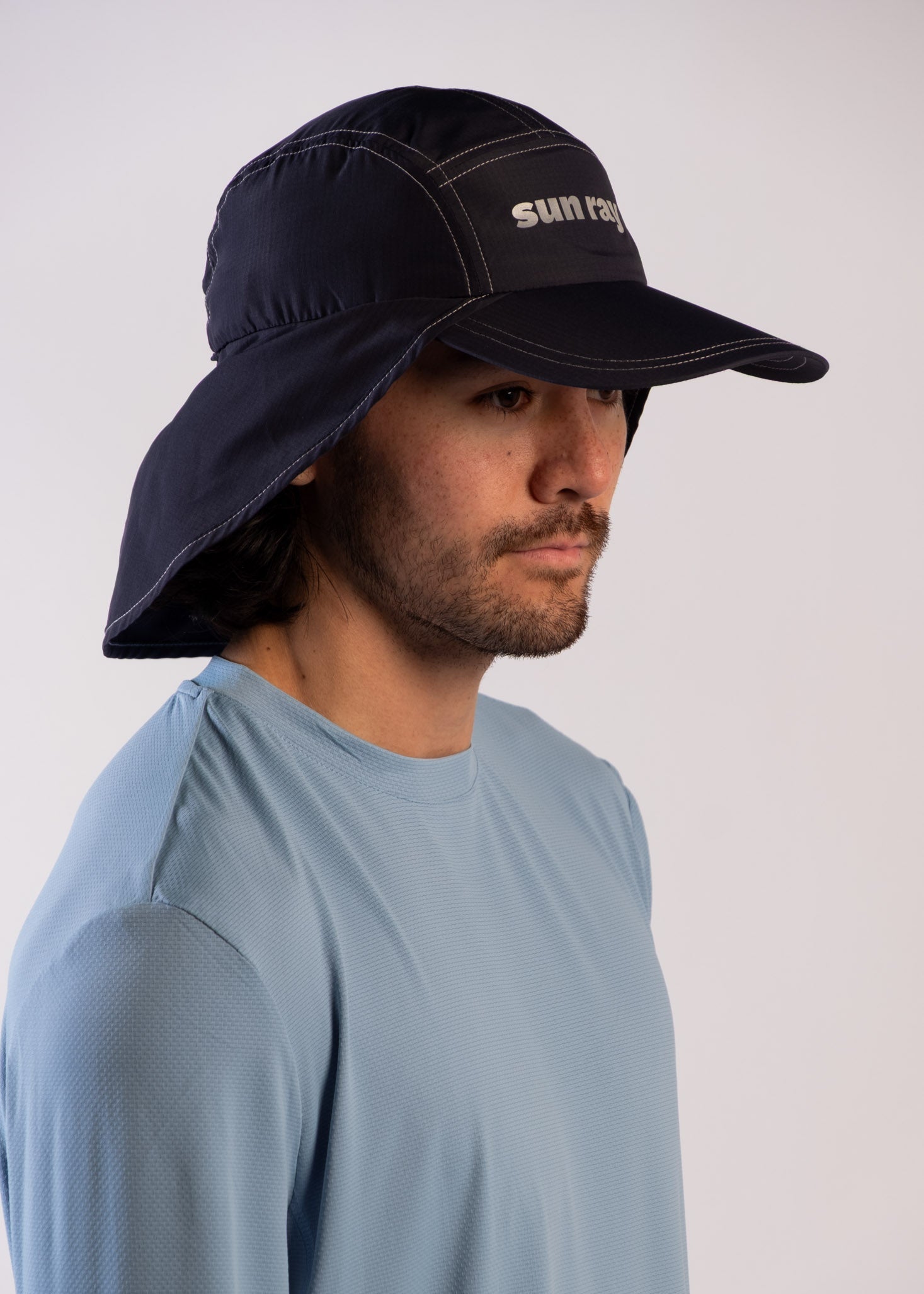 Person wearing a UPF50+ navy legionnaire hat