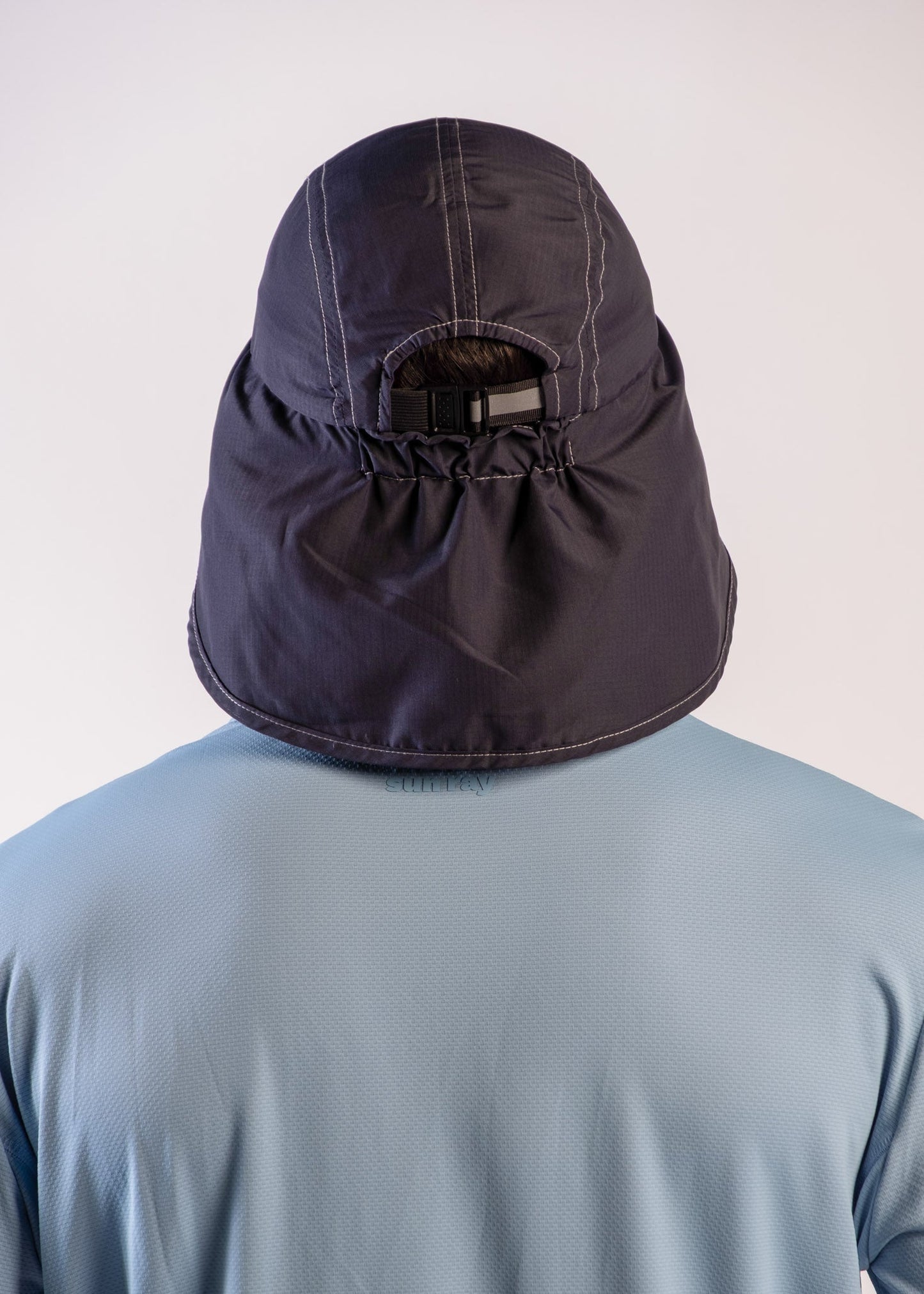 Person wearing a UPF50+ navy legionnaire hat