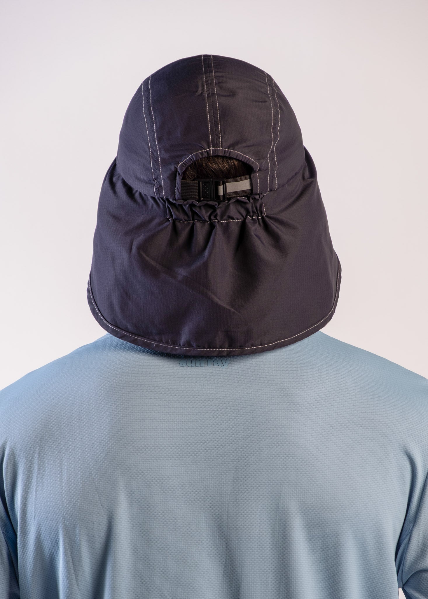 Person wearing a UPF50+ navy legionnaire hat