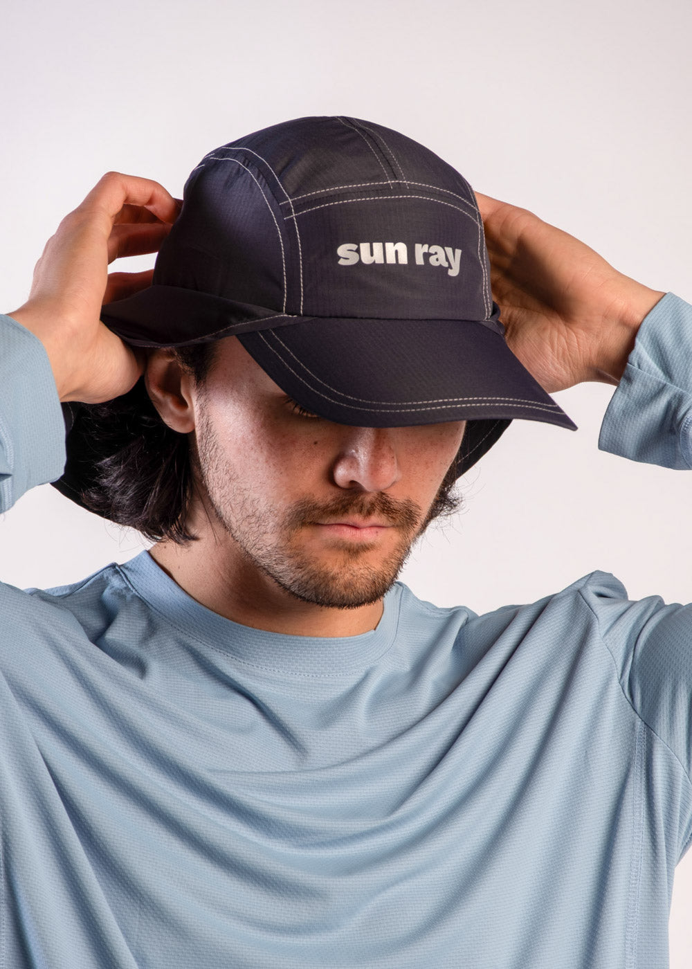 Person wearing a UPF50+ navy legionnaire hat