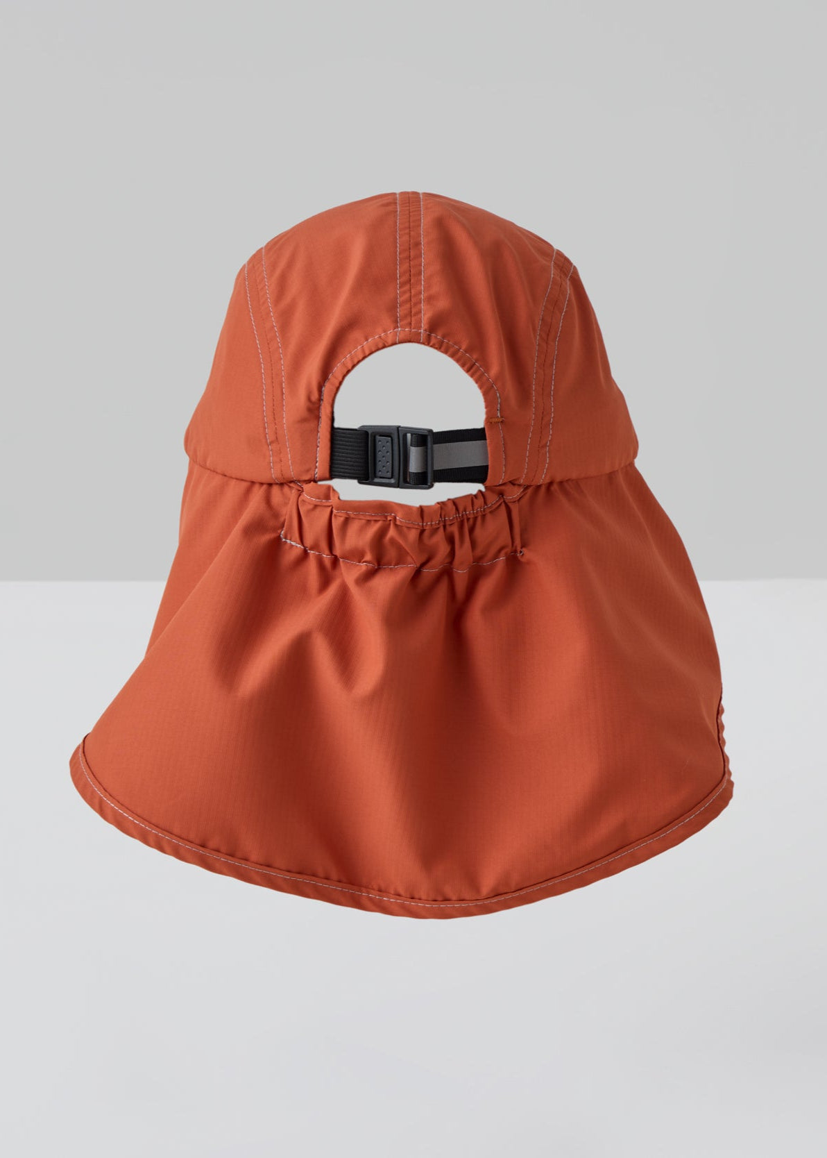 An orange UPF50+ sun protection legionnaire hat