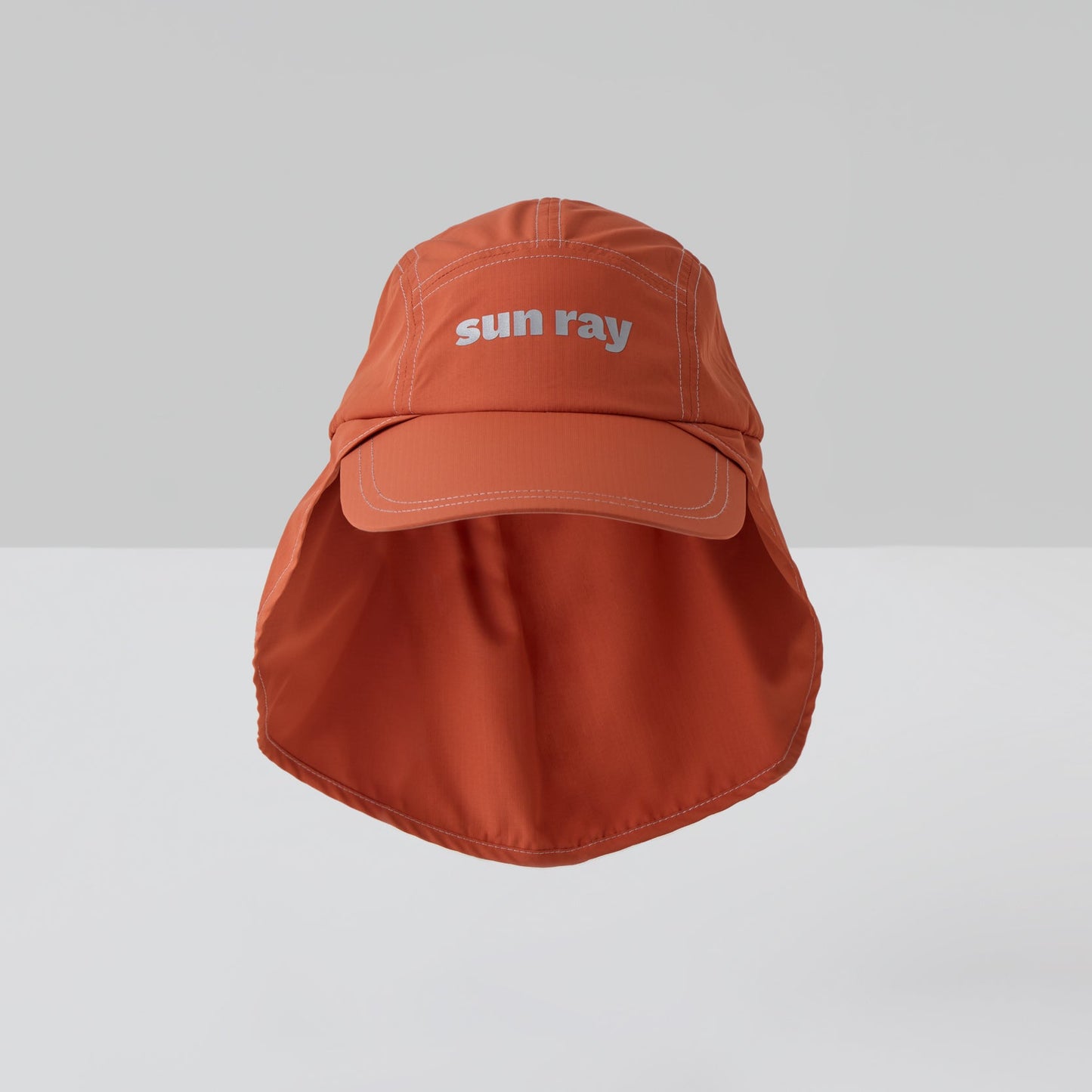 An orange UPF50+ sun protection legionnaire hat