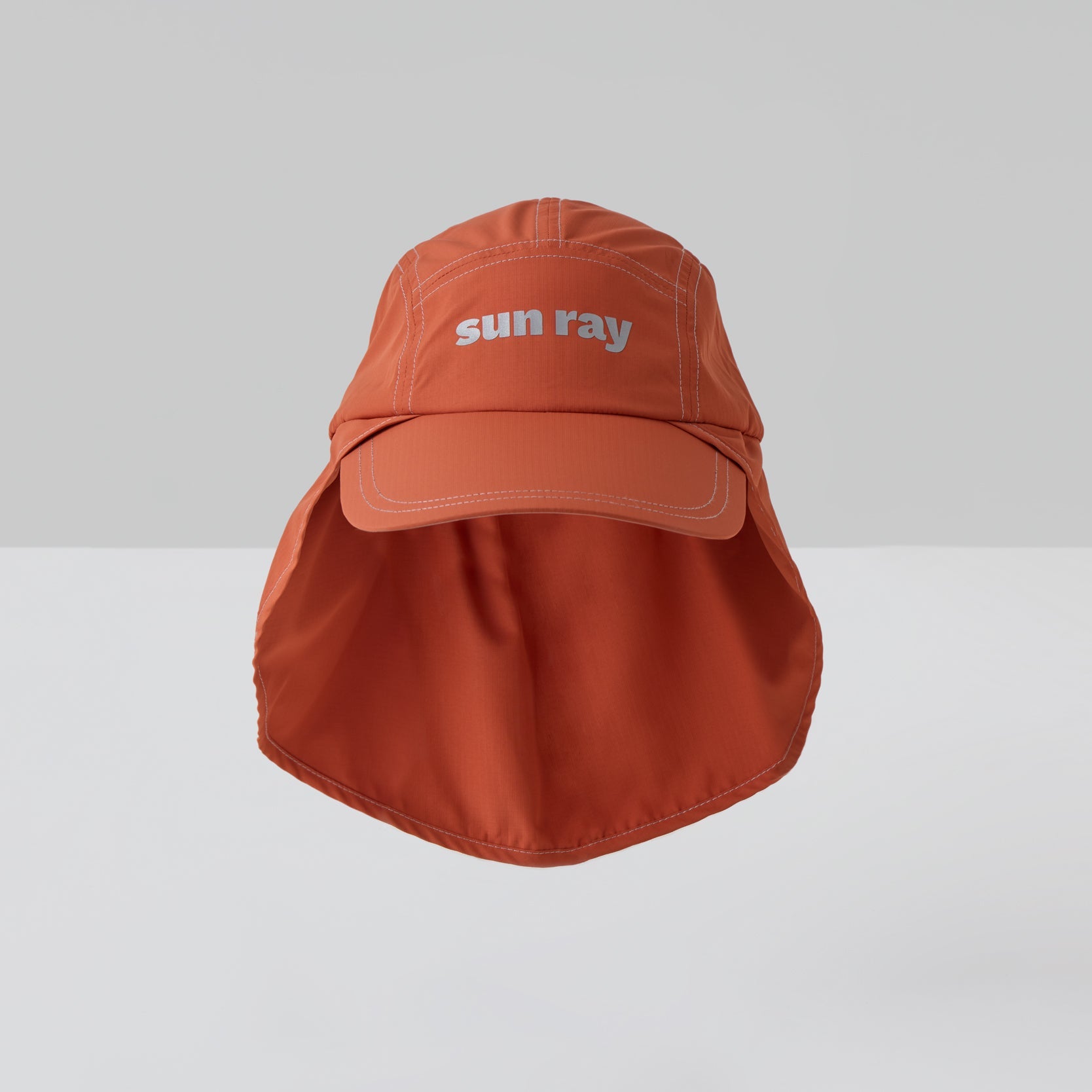 An orange UPF50+ sun protection legionnaire hat