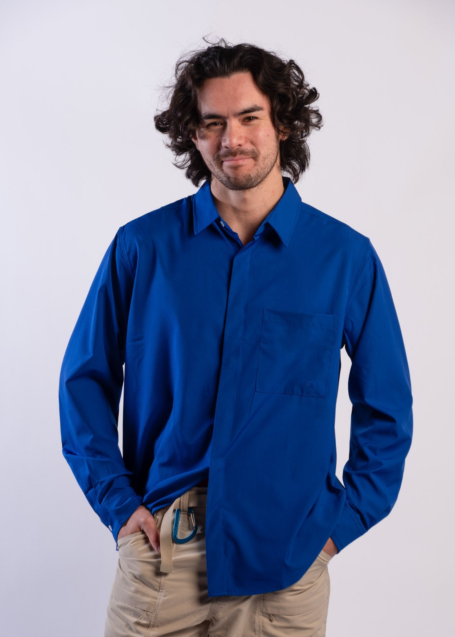Person wearing a blue UPF50+ Sun protection sun shirt on a white background
