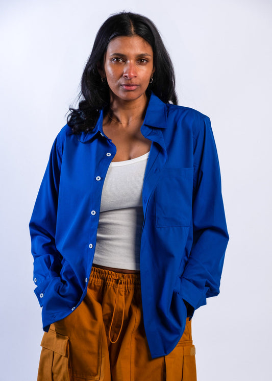Person wearing a blue UPF50+ Sun protection sun shirt on a white background