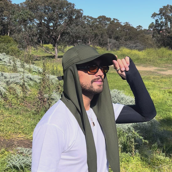 Man wearing Sun Ray UPF50+ scarf cap with neck scarf worn loose on a walking track